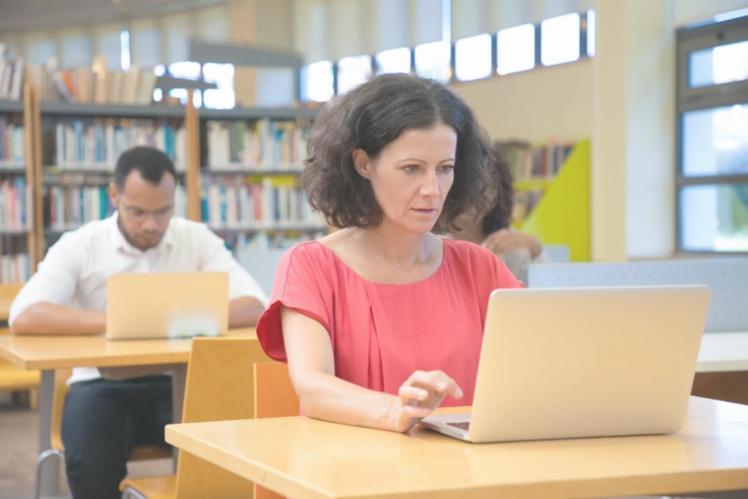 Software professionals collaborating during bug tracking workshop session